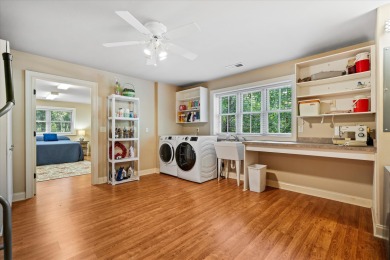 Nestled on a picturesque tree-lined street, this expansive home on Charleston National Golf Club in South Carolina - for sale on GolfHomes.com, golf home, golf lot
