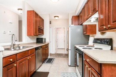 Welcome to this inviting, corner unit condominium, thoughtfully on Fellows Creek Golf Club in Michigan - for sale on GolfHomes.com, golf home, golf lot
