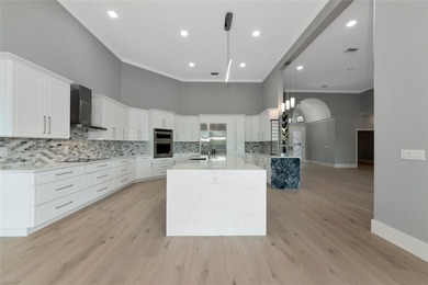 **BRILLIANTLY UPDATED, MOVE-IN READY, GOLF COURSE ESTATE in the on The Oaks Club in Florida - for sale on GolfHomes.com, golf home, golf lot