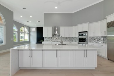 **BRILLIANTLY UPDATED, MOVE-IN READY, GOLF COURSE ESTATE in the on The Oaks Club in Florida - for sale on GolfHomes.com, golf home, golf lot