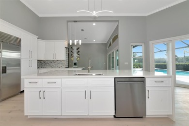 **BRILLIANTLY UPDATED, MOVE-IN READY, GOLF COURSE ESTATE in the on The Oaks Club in Florida - for sale on GolfHomes.com, golf home, golf lot