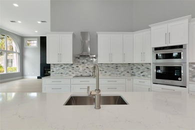 **BRILLIANTLY UPDATED, MOVE-IN READY, GOLF COURSE ESTATE in the on The Oaks Club in Florida - for sale on GolfHomes.com, golf home, golf lot