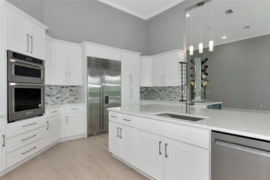 **BRILLIANTLY UPDATED, MOVE-IN READY, GOLF COURSE ESTATE in the on The Oaks Club in Florida - for sale on GolfHomes.com, golf home, golf lot