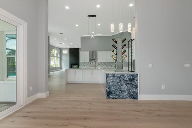 **BRILLIANTLY UPDATED, MOVE-IN READY, GOLF COURSE ESTATE in the on The Oaks Club in Florida - for sale on GolfHomes.com, golf home, golf lot