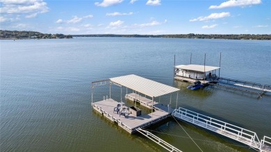 The back porch to this lake house has some of the prettiest on Hideout Golf Club and Resort  in Texas - for sale on GolfHomes.com, golf home, golf lot