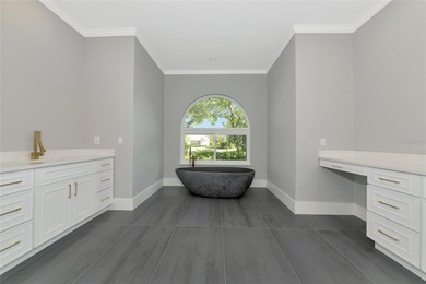 **BRILLIANTLY UPDATED, MOVE-IN READY, GOLF COURSE ESTATE in the on The Oaks Club in Florida - for sale on GolfHomes.com, golf home, golf lot