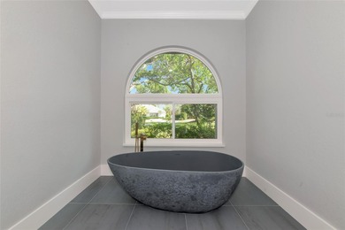 **BRILLIANTLY UPDATED, MOVE-IN READY, GOLF COURSE ESTATE in the on The Oaks Club in Florida - for sale on GolfHomes.com, golf home, golf lot