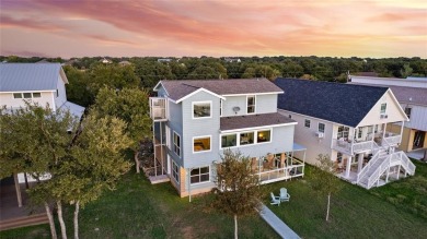 The back porch to this lake house has some of the prettiest on Hideout Golf Club and Resort  in Texas - for sale on GolfHomes.com, golf home, golf lot