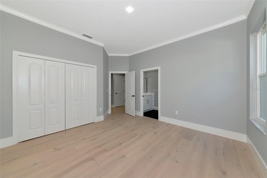 **BRILLIANTLY UPDATED, MOVE-IN READY, GOLF COURSE ESTATE in the on The Oaks Club in Florida - for sale on GolfHomes.com, golf home, golf lot