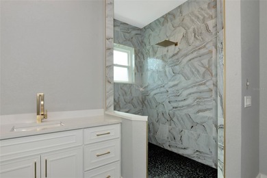 **BRILLIANTLY UPDATED, MOVE-IN READY, GOLF COURSE ESTATE in the on The Oaks Club in Florida - for sale on GolfHomes.com, golf home, golf lot