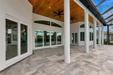 **BRILLIANTLY UPDATED, MOVE-IN READY, GOLF COURSE ESTATE in the on The Oaks Club in Florida - for sale on GolfHomes.com, golf home, golf lot