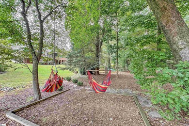 Refined design meets thoughtful functionality in this on Woodfin Ridge Golf Club in South Carolina - for sale on GolfHomes.com, golf home, golf lot