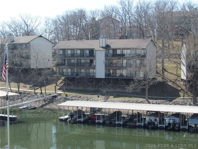 Top-floor waterfront condo featuring 3 bedrooms, 2 bathrooms on Seasons Ridge At Four Seasons in Missouri - for sale on GolfHomes.com, golf home, golf lot
