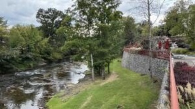 Riverstone Resort & Spa is an upscale riverfront resort located on Gatlinburg Golf Course in Tennessee - for sale on GolfHomes.com, golf home, golf lot