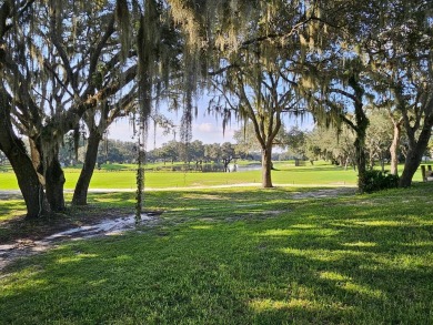 This is a 2006 Palm Harbor split 3-bedroom plan with 1,560' of on Southport Springs Golf Club in Florida - for sale on GolfHomes.com, golf home, golf lot