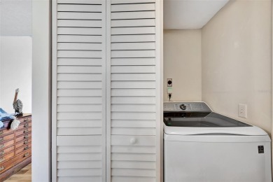 This 6th floor corner condo boasts a spacious open floor plan on Isla Del Sol Yacht and Country Club in Florida - for sale on GolfHomes.com, golf home, golf lot