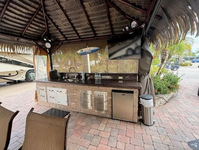 STUNNING LAKE VIEW! Get ready to fall in love with this on Motorcoach Resort Golf Course in Florida - for sale on GolfHomes.com, golf home, golf lot