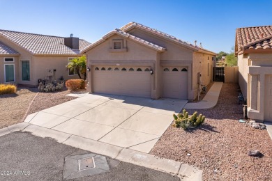 Nestled in the serene cul-de-sac of the prestigious Coyote Lakes on Coyote Lakes Golf Club in Arizona - for sale on GolfHomes.com, golf home, golf lot