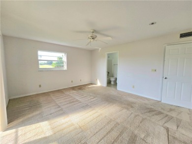 Your canvas awaits! Just needs a little TLC to make it shine on The American Golf Club in Florida - for sale on GolfHomes.com, golf home, golf lot