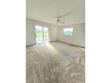 Your canvas awaits! Just needs a little TLC to make it shine on The American Golf Club in Florida - for sale on GolfHomes.com, golf home, golf lot