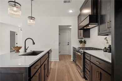 Discover modern, low-maintenance luxury living in this stunning on The Golf Club of Kansas in Kansas - for sale on GolfHomes.com, golf home, golf lot