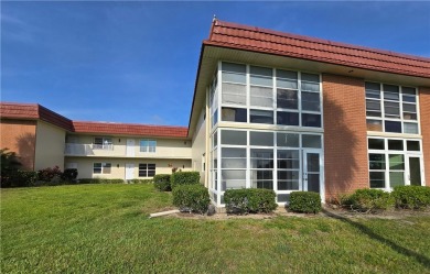Your canvas awaits! Just needs a little TLC to make it shine on The American Golf Club in Florida - for sale on GolfHomes.com, golf home, golf lot