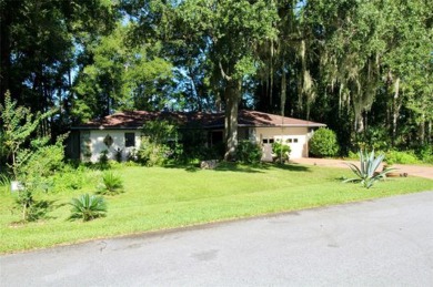 Discover your dream home in the serene Rainbow Springs Country on Rainbow Springs Golf and Country Club in Florida - for sale on GolfHomes.com, golf home, golf lot