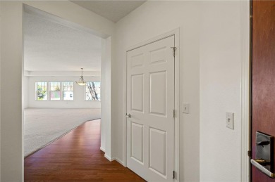 Welcome to this sun-drenched corner unit overlooking the serene on Edinburgh USA in Minnesota - for sale on GolfHomes.com, golf home, golf lot