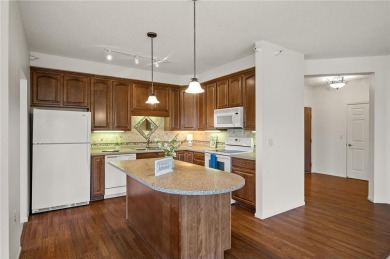 Welcome to this sun-drenched corner unit overlooking the serene on Edinburgh USA in Minnesota - for sale on GolfHomes.com, golf home, golf lot