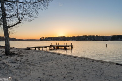 Tucked away just steps from Jackson Lake, this beautifully on Turtle Cove Golf Course in Georgia - for sale on GolfHomes.com, golf home, golf lot