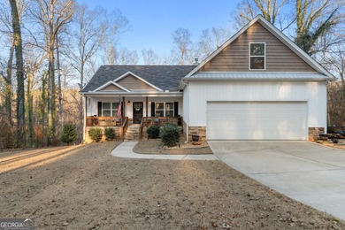 Tucked away just steps from Jackson Lake, this beautifully on Turtle Cove Golf Course in Georgia - for sale on GolfHomes.com, golf home, golf lot