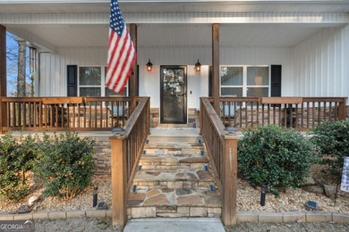 Tucked away just steps from Jackson Lake, this beautifully on Turtle Cove Golf Course in Georgia - for sale on GolfHomes.com, golf home, golf lot