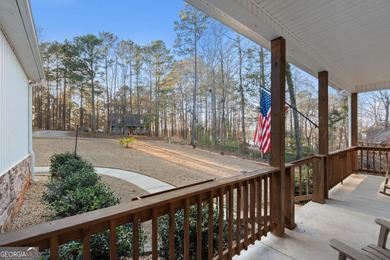 Tucked away just steps from Jackson Lake, this beautifully on Turtle Cove Golf Course in Georgia - for sale on GolfHomes.com, golf home, golf lot