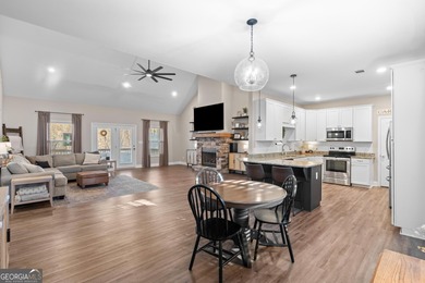 Tucked away just steps from Jackson Lake, this beautifully on Turtle Cove Golf Course in Georgia - for sale on GolfHomes.com, golf home, golf lot