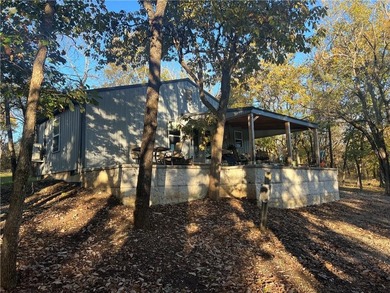 Modern Lakefront Retreat -- Built in 2023, this thoughtfully on Sugar Valley Lakes Golf Course in Kansas - for sale on GolfHomes.com, golf home, golf lot