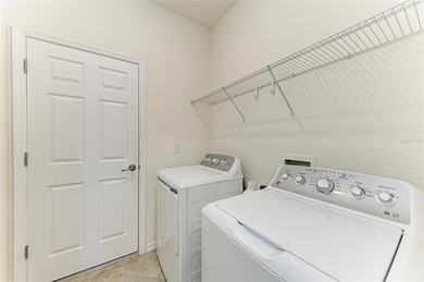 Imagine living in a community where neighbors become friends on Sarasota National Golf Club in Florida - for sale on GolfHomes.com, golf home, golf lot