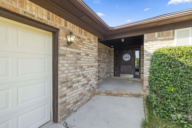 Welcome to this inviting 3-bedroom, 2.5-bath home on the golf on Lake Forest Yacht and Country Club in Alabama - for sale on GolfHomes.com, golf home, golf lot