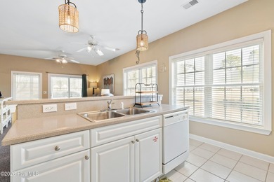 Welcome to this beautifully furnished first-floor, 2-bedroom on Sea Trail Golf Resort in North Carolina - for sale on GolfHomes.com, golf home, golf lot