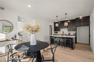 Discover modern, low-maintenance living in this stunning 1 on The Golf Club of Kansas in Kansas - for sale on GolfHomes.com, golf home, golf lot