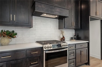 Discover modern, low-maintenance living in this stunning 1 on The Golf Club of Kansas in Kansas - for sale on GolfHomes.com, golf home, golf lot