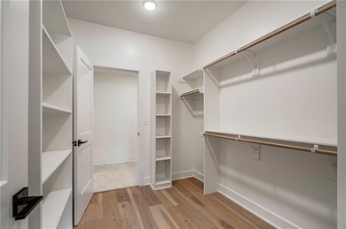 Discover modern, low-maintenance living in this stunning 1 on The Golf Club of Kansas in Kansas - for sale on GolfHomes.com, golf home, golf lot