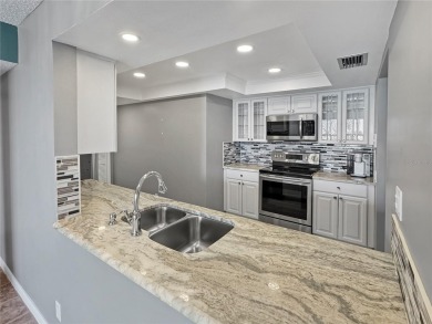Under contract-accepting backup offers. Experience tranquility on Isla Del Sol Yacht and Country Club in Florida - for sale on GolfHomes.com, golf home, golf lot