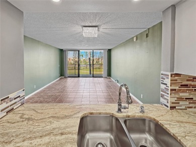 Under contract-accepting backup offers. Experience tranquility on Isla Del Sol Yacht and Country Club in Florida - for sale on GolfHomes.com, golf home, golf lot