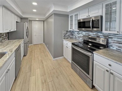 Under contract-accepting backup offers. Experience tranquility on Isla Del Sol Yacht and Country Club in Florida - for sale on GolfHomes.com, golf home, golf lot