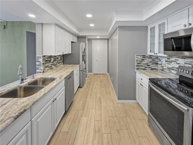Under contract-accepting backup offers. Experience tranquility on Isla Del Sol Yacht and Country Club in Florida - for sale on GolfHomes.com, golf home, golf lot