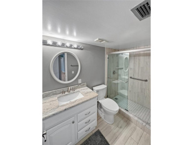 Under contract-accepting backup offers. Experience tranquility on Isla Del Sol Yacht and Country Club in Florida - for sale on GolfHomes.com, golf home, golf lot