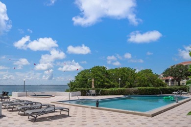 Under contract-accepting backup offers. Experience tranquility on Isla Del Sol Yacht and Country Club in Florida - for sale on GolfHomes.com, golf home, golf lot