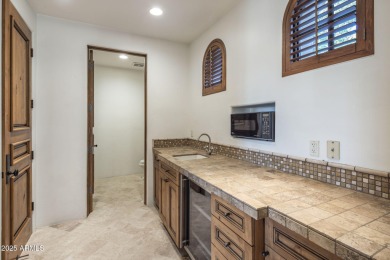 Set on an expansive acre-plus lot within Hidden Paradise--a on Camelback Golf Club in Arizona - for sale on GolfHomes.com, golf home, golf lot