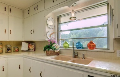 Welcome to this beautifully crafted ranch-style residence that on Mount Pleasant Country Club in Texas - for sale on GolfHomes.com, golf home, golf lot