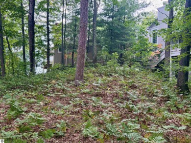 Discover a one-of-a-kind opportunity to build your dream cottage on  in Michigan - for sale on GolfHomes.com, golf home, golf lot